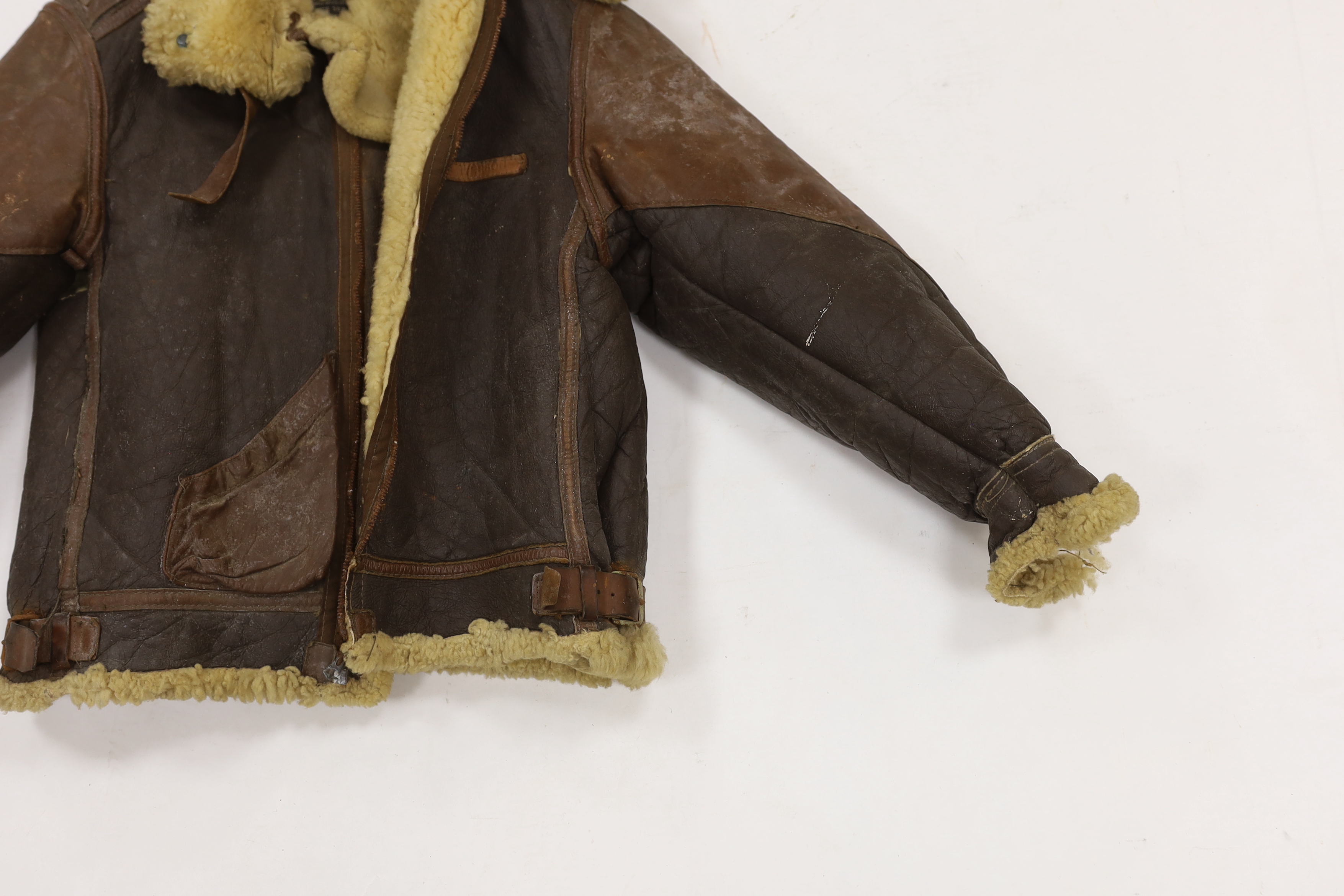 A United States Air Force Type B-3 sheepskin flying jacket, with label to collar reading; ‘Type B-3 DWG. No.33H5595 AC Order No.43-13609-AF Size 38R Property Air Force U.S. Army’